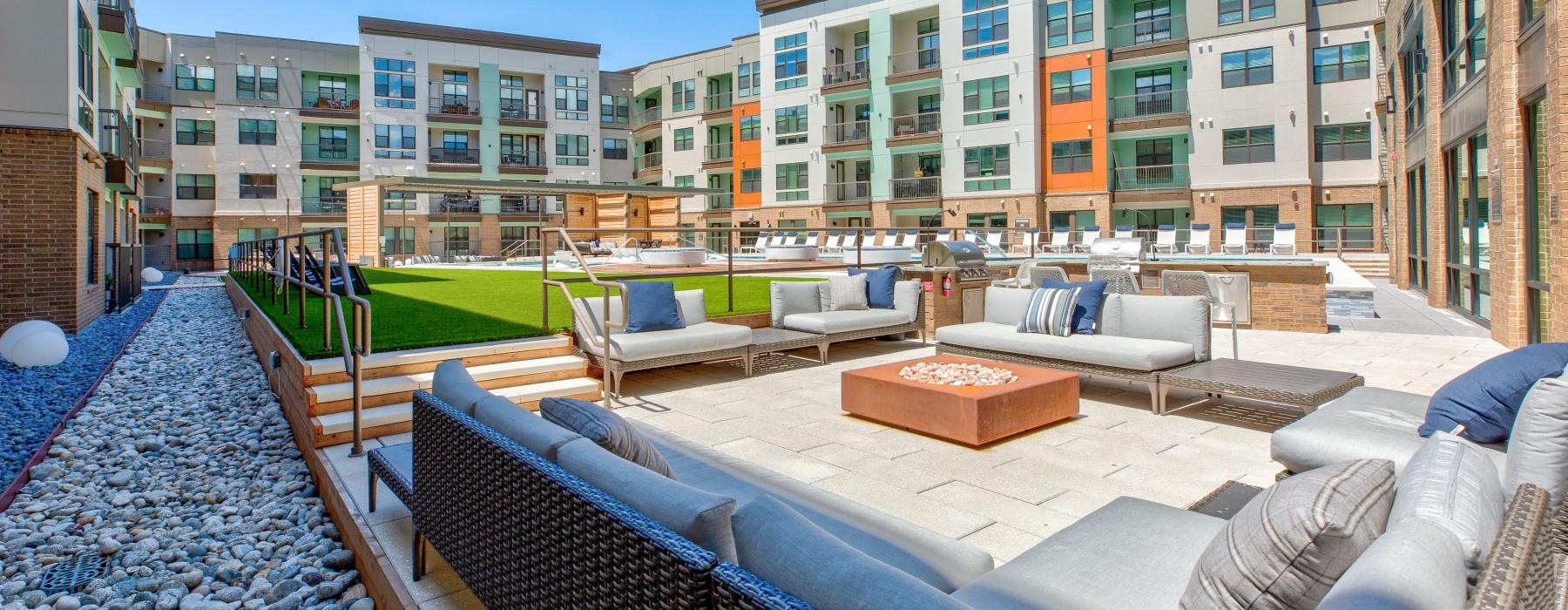 a courtyard with a pool and buildings