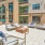 a building with a patio and chairs