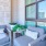 a room with a couch and chairs