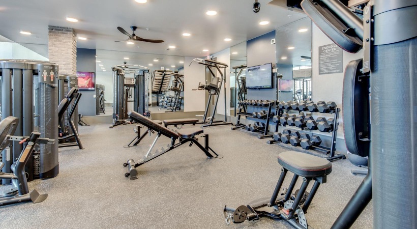 Quick access to state-of-the-art amenities a gym with exercise equipment