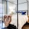 a bedroom with a bed and a lamp